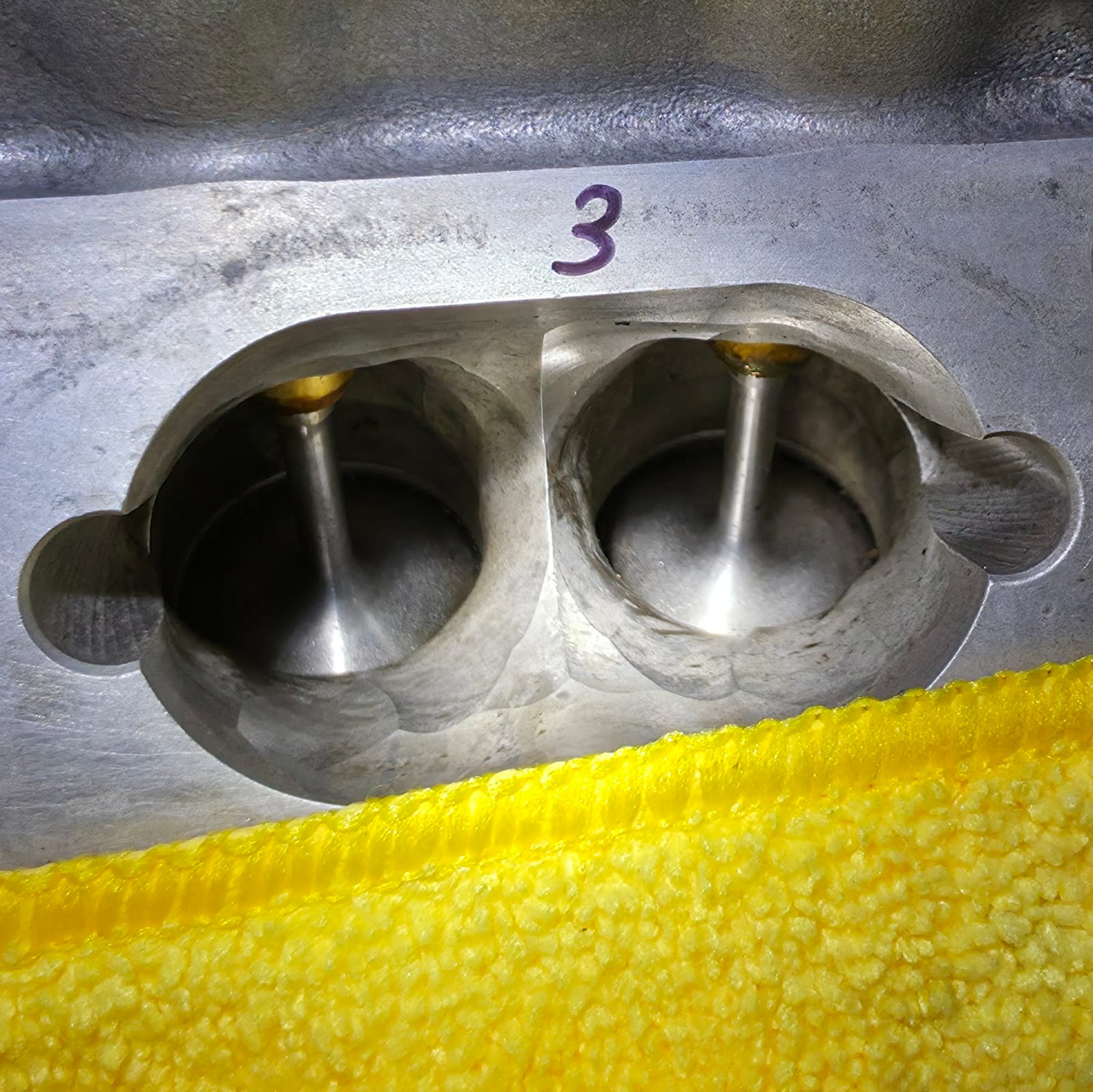 Audi RS4 cylinder ports after walnut blasting with clean metal surfaces