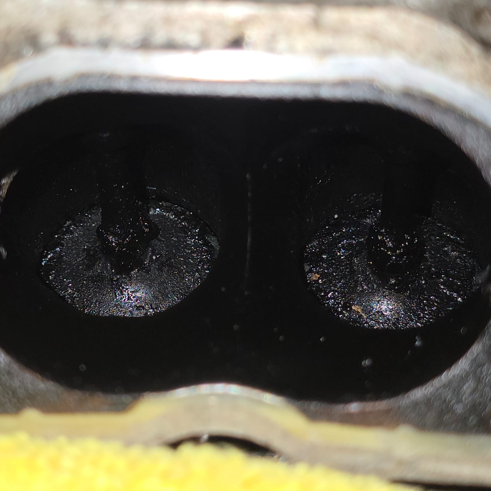 Audi RS4 cylinder ports with heavy carbon build-up before walnut blasting
